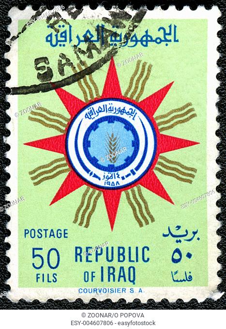 IRAQ - CIRCA 1959: A stamp printed in Iraq shows Emblem of Republic of Iraq, circa 1959