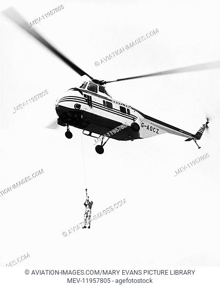 Civil Demonstrator Westland Ws-55 Whirlwind with a Long-Line Winch Hauling a Man