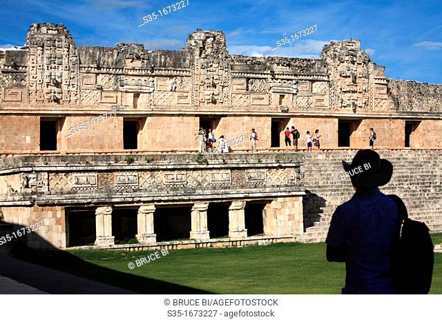 Visitor in the Nunnery Quadrangle Cuadrangulo de las Monjas in the ancient Mayan city of Uxmal  Uxmal  Mexico