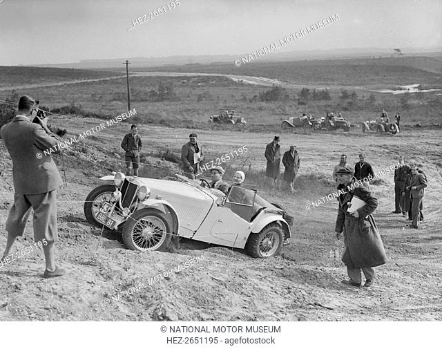MG TA of the Cream Cracker Team competing in the Great Weat Motor Club Trial, 1938. Artist: Bill Brunell