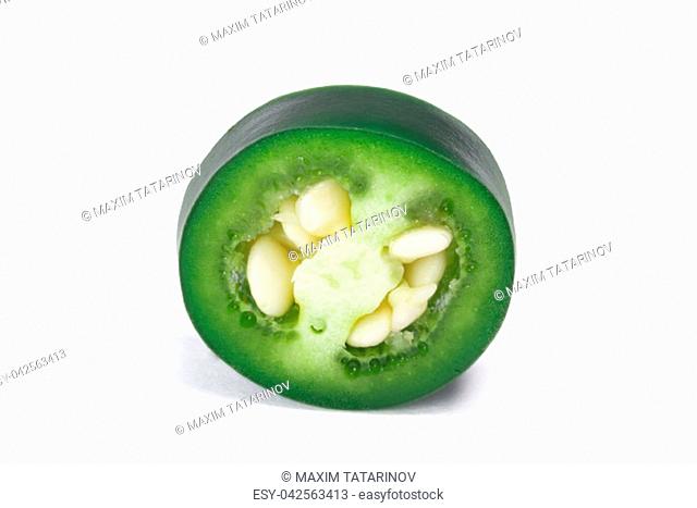 Slice of green Serrano pepper (Capsicum annuum). Clipping path, shadow separated
