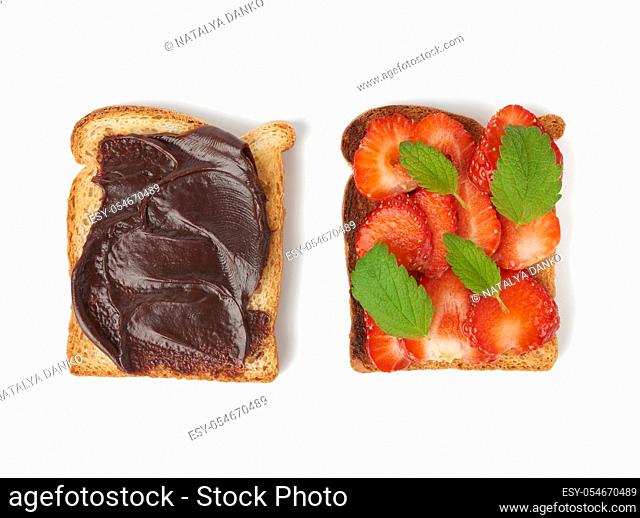 sandwich of white bread and fresh red strawberries and with chocolate paste, food is isolated on a white background, top view