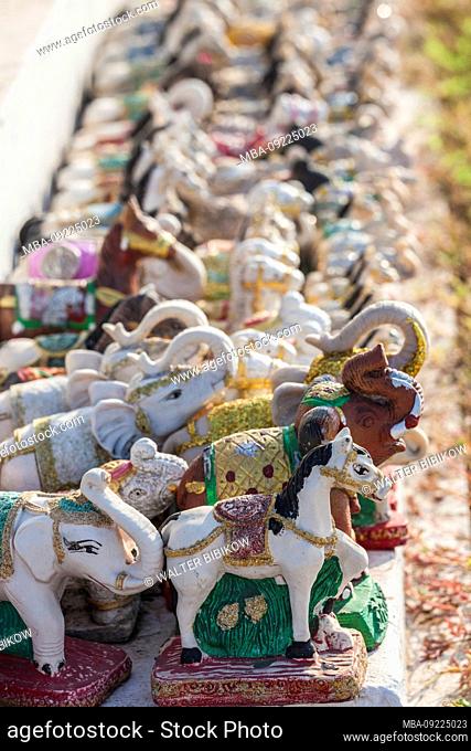 Laos, Vientiane, Mekong Riverfront shrine with elephnat miniatures