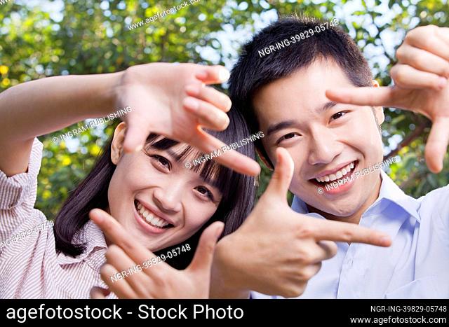Young Couple Looking At Camera