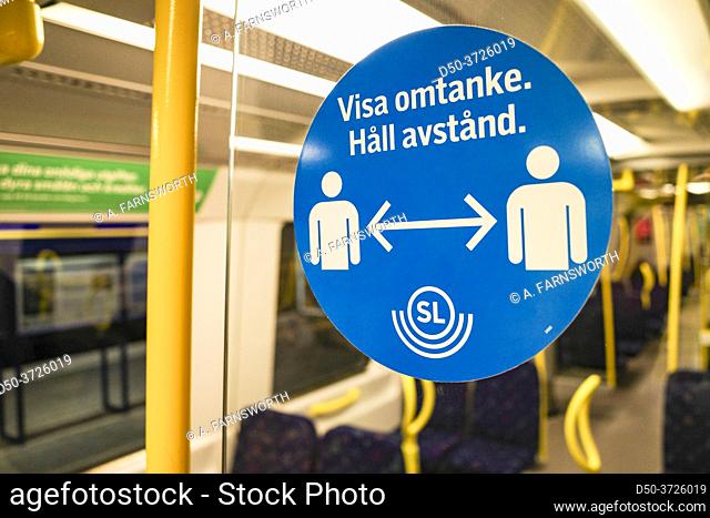 Stockholm Sweden A sign in Swedish on the subway says to keep your distance