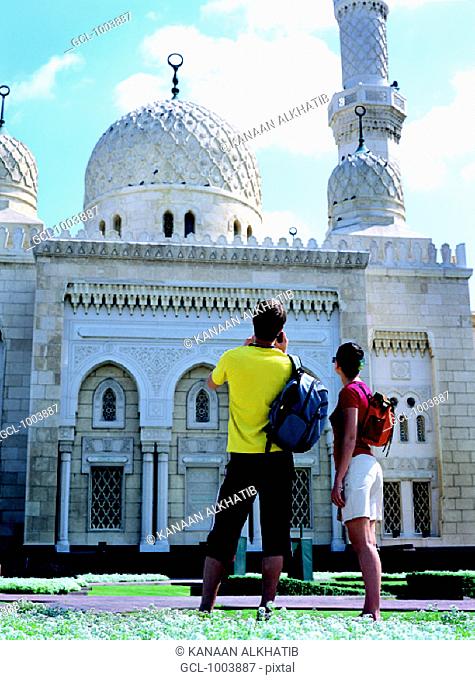 Western tourists at Jumeirah Mosque in Dubai, United Arab Emirates