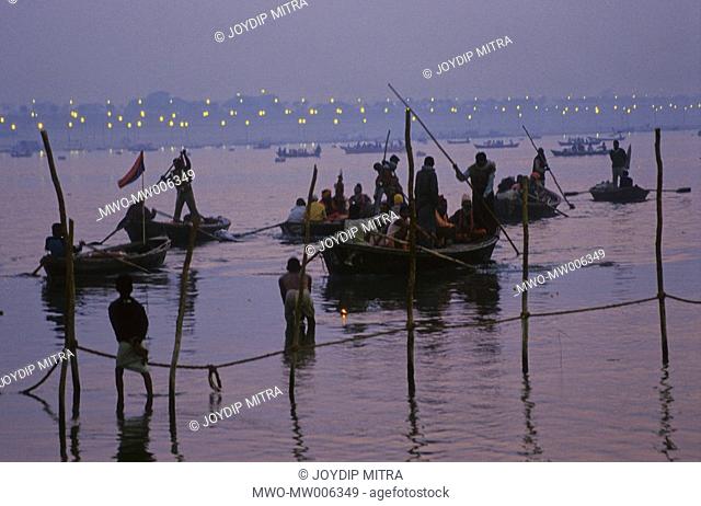 Pilgrims in water late in the evening The Ardha Kumbha Half Kumbha is a very sacred and auspicious time cycle During this time Hindu pilgrims from all over...