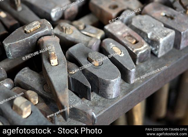 25 March 2022, Saxony-Anhalt, Wernigerode: Blacksmith's hammers lie in the Atelierschmiede at the train station. Wolf-Dieter Wittig's metalworking store is one...