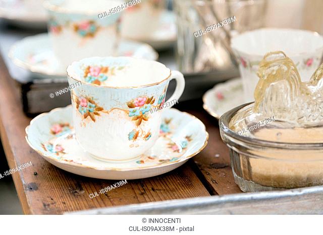 Vintage teacup and saucer on wooden table