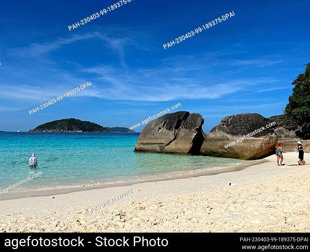 05 February 2023, Thailand, Similan Islands: People linger on the beach in the Similan Islands. Thailand would like to have large parts of the Andaman Sea with...