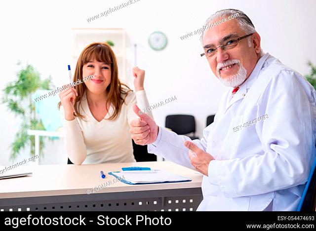 Pregnant woman visiting doctor gynecologist
