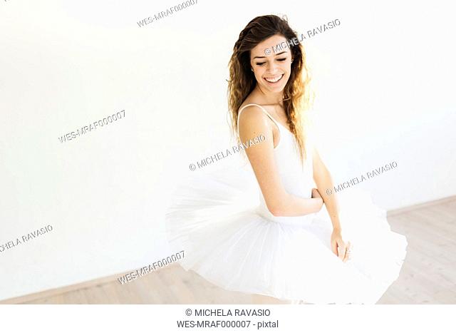 Portrait of a smiling ballet dancer in a tutu