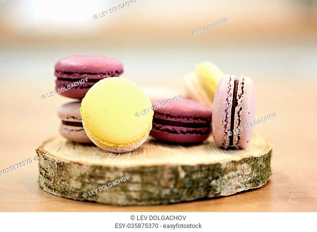 different macarons on wooden stand