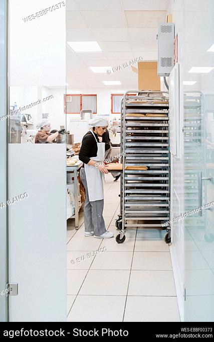 Bakers working at bakery
