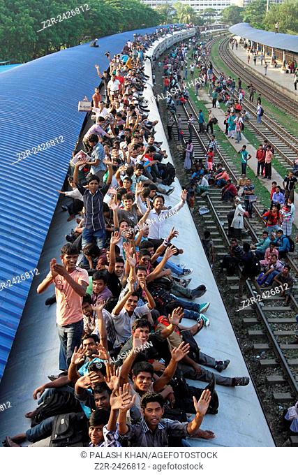 Thousands of Bangladeshis cram onto trains at the Airport Railway Terminal on the outskirts of Dhaka on October 13, ahead of Eid-al Adha