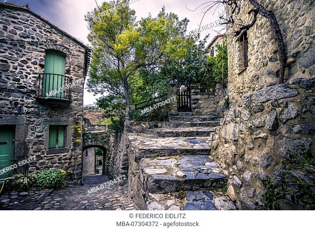 Alley, houses and stairs of stone in the village center