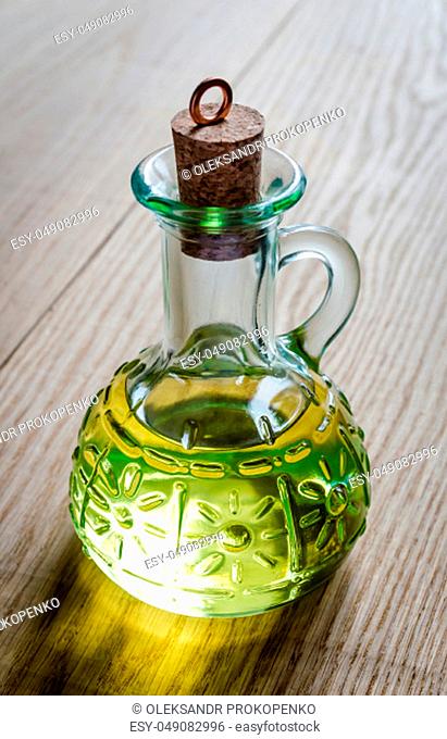 Small bottle of olive oil with cork stopper