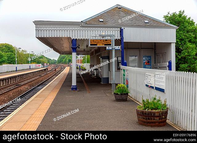 Dalmeny, Scotland - May 24, 2018: Rural railway station with platform and ticket office near Queensferry and Edinburgh, Scotland