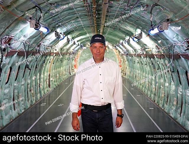 24 August 2022, Hamburg: André Walter, Managing Director of Airbus Aerostructures GmbH, stands in an A320 aircraft fuselage in hangar 260 on the Airbus site in...