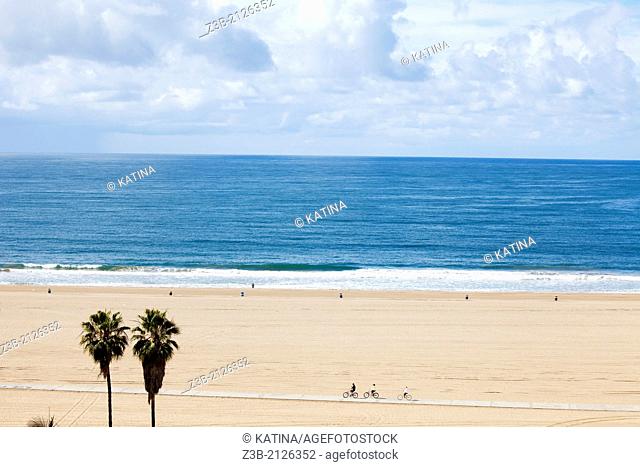 Horizontal aerial view of Santa Monica beach, as seen from the cliffs at Palisades Park, with view of vast expanse of sand, Los Angeles, California, USA