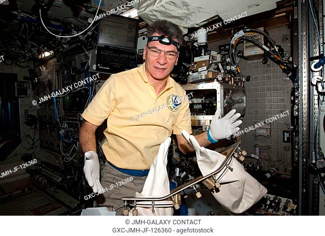 European Space Agency astronaut Paolo Nespoli, Expedition 26 flight engineer, works with the Light Microscopy Module (LMM) Spindle Bracket Assembly in the...