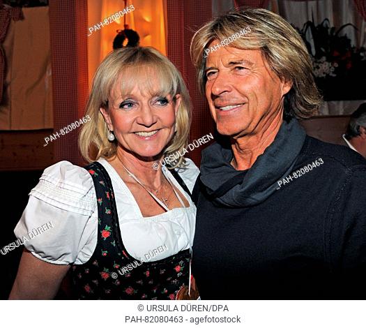 Former skiers Christa Kinshofer and Hansi Hinterseer pose at the get-together of the Bavarian evening in the context of the 29th Kaiser Cup golf tournament of...