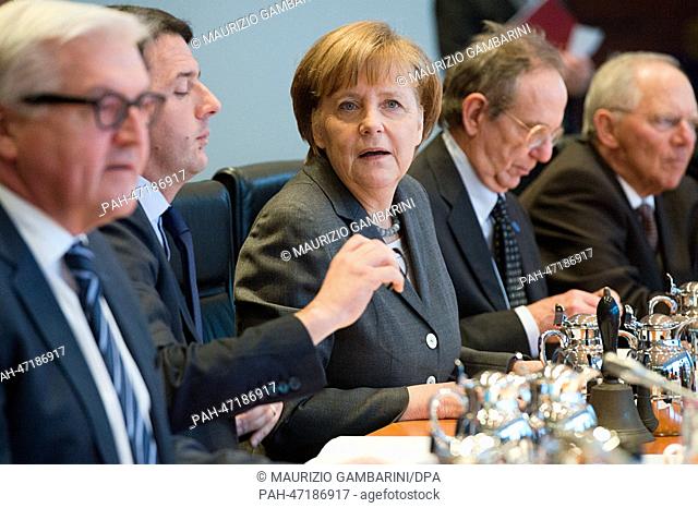German Chancellor Angela Merkel (CDU, C) and new Italian Prime Minister Matteo Renzi (2-L) meet with representatives of their governments for a cabinet session...
