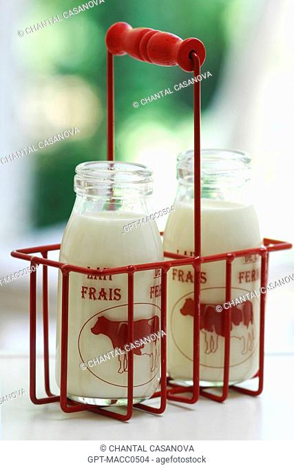 COW'S MILK IN A TRADITIONAL GLASS BOTTLE, BEVERAGE RICH IN CALCIUM, VITAMINS AND TRACE MINERALS BUT SOMETIMES DIFFICULT TO DIGEST