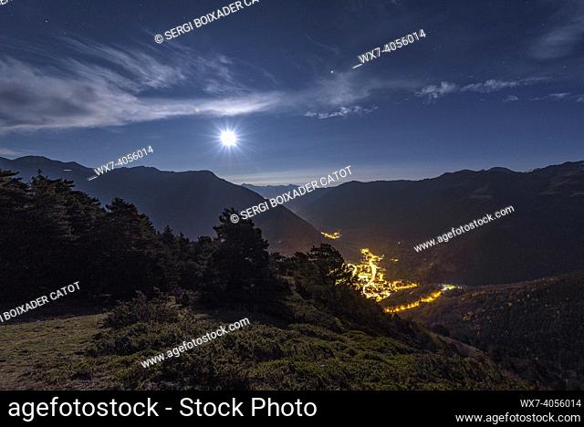 Vielha city and valley seen from near the Bassa d'Oles on a full moon night (Aran Valley, Catalonia, Spain, Pyrenees)