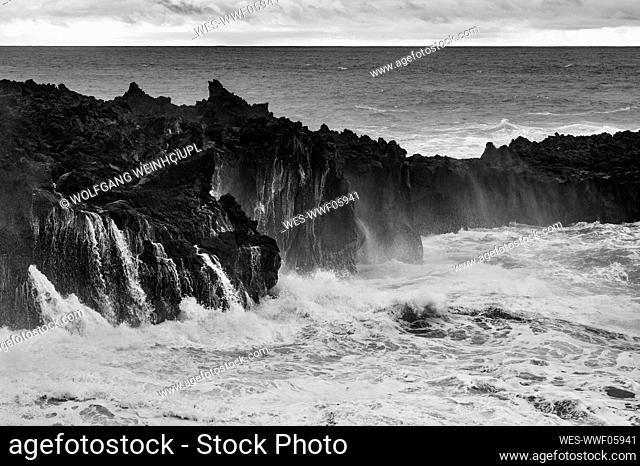 Volcanic coast with high tide waves in Ponta da Ferraria, San Miguel, Azores, Portugal