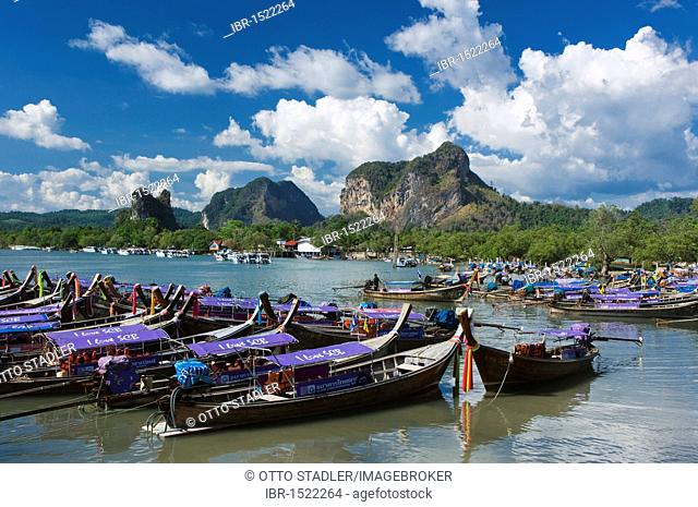 Long-tail boats in Nopparat Thara Bay, limestone rocks, Krabi, Thailand, Asia