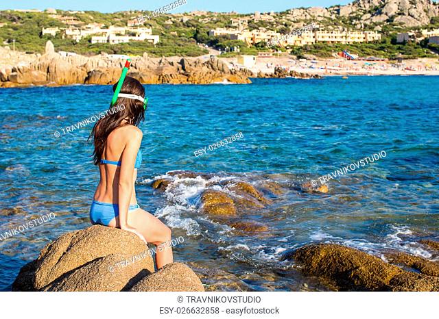 Young woman with snorkeling equipment