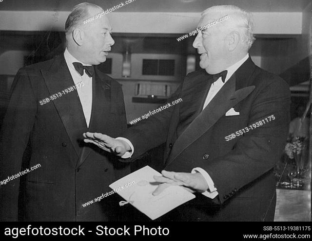 Mr. Menzies Tells The Duke - The Duke of Gloucester, President of the Australia club (left), seems to be spellbound by a story being told to him by Australian...