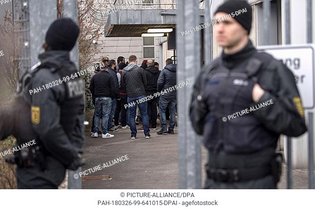 dpatop - 26 March 2018, Germany, Stuttgart: Visitors standing at the entrance to the court before the start of the trial against alleged leader of the Turkish...