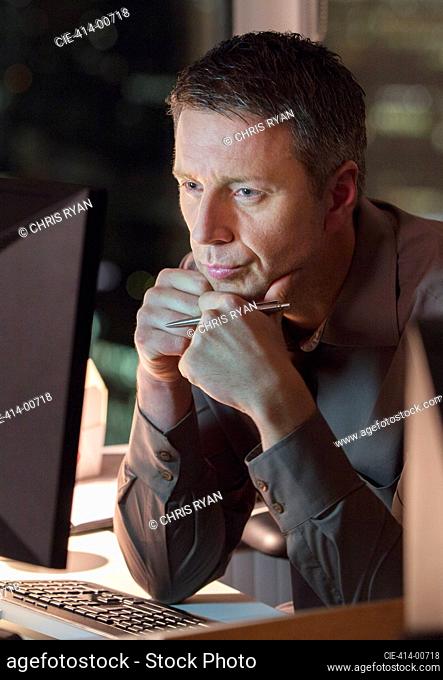 Businessman working late at laptop