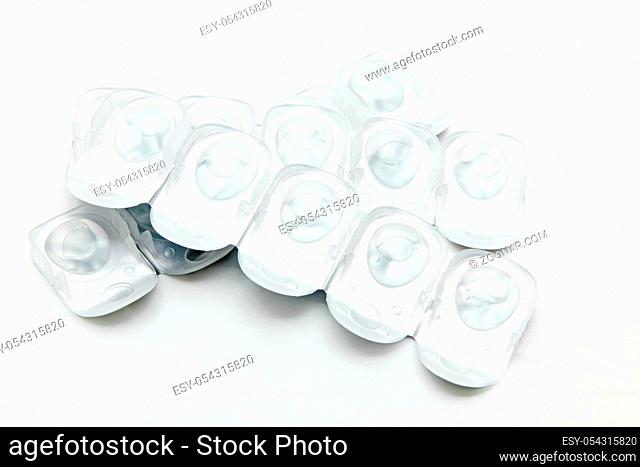 stack of disposal contact lense isolated on white