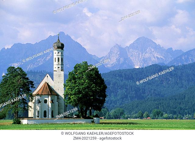 GERMANY, BAVARIA, NEAR FUSSEN, ST. KOLOMAN CHURCH, MOUNTAINS IN BACKGROUND