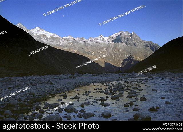 NEPAL Langmoche -- Dec 2005 -- Pretty but lethal. . . a small morrain dyke is the only defence of a glacial overburst spill from Dig Tsho lake into the...
