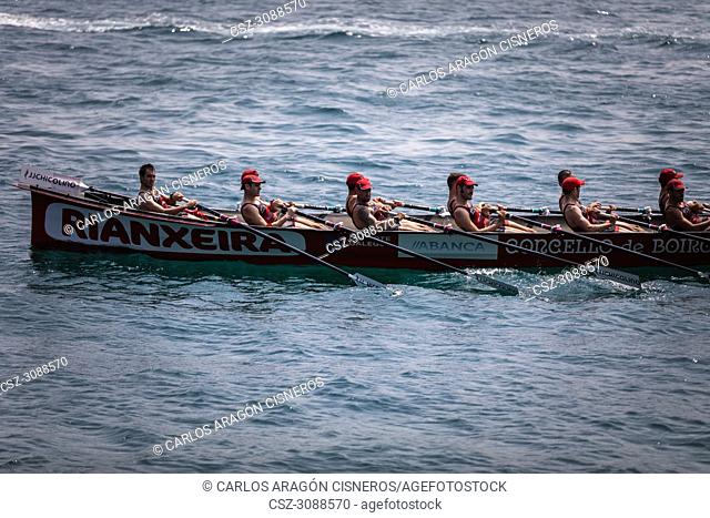 CASTRO URDIALES, SPAIN - JULY 15, 2018: Competition of boats, regata of trainera, Cabo boat in action in the VI Bandera CaixaBank competition