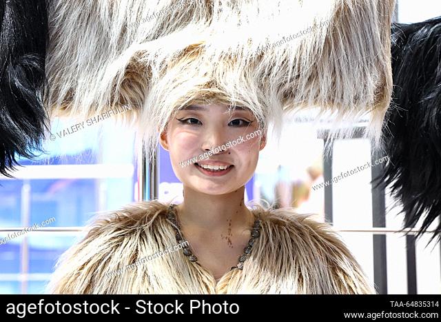RUSSIA, MOSCOW - NOVEMBER 15, 2023: A model in a fancy costume is seen during the opening of Buryatia Day at Pavilion No