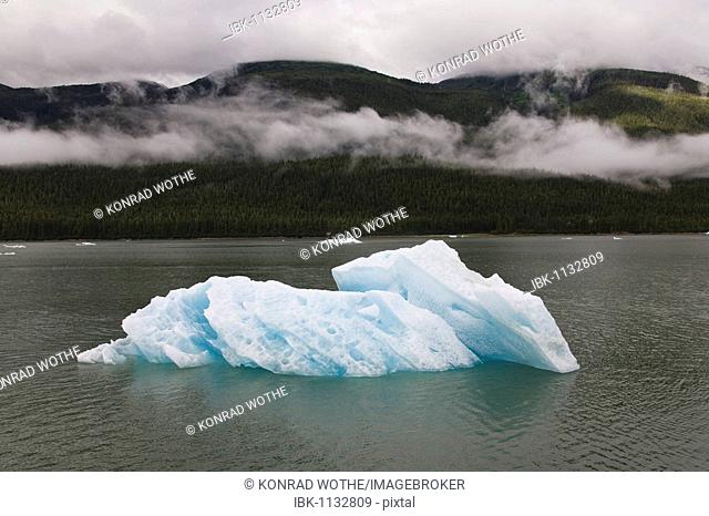 Iceberg and clouds in Inside Passage, Southeast Alaska, USA