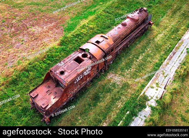 Old train cemetery. Aerial view of an old abandoned rusty steam train. High quality 4k footage