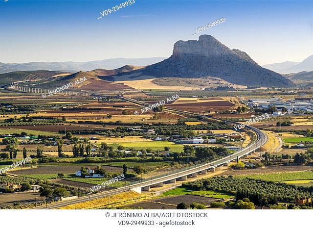 Panoramic view. La Peña de los Enamorados, Lovers Rock or Montaña del Indio & High Speed Train Line AVE, Antequera. Málaga province, Andalusia