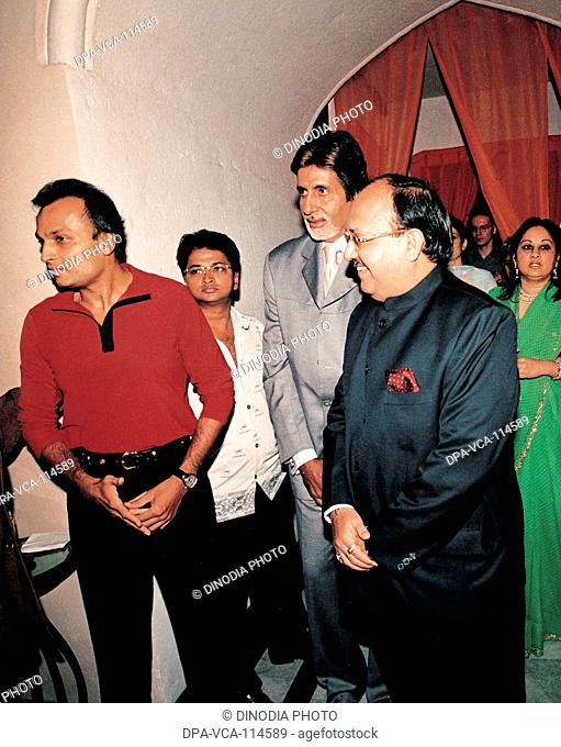 South Asian Indian industrialist Anil Ambani ; actor Amitabh Bachchan and Amar Singh at a party in Taj mahal hotel ; Bombay Mumbai  ; Maharashtra ; India NO MR