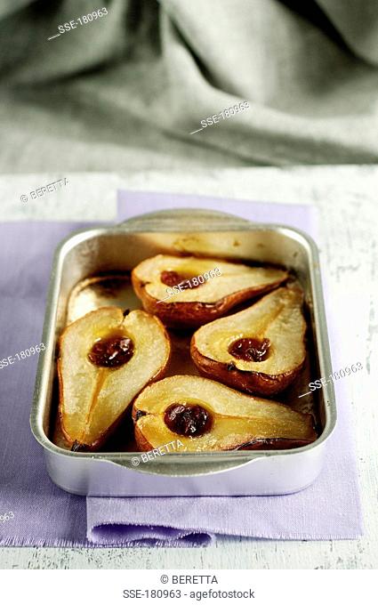 Roast pears with maple syrup , dried cranberries