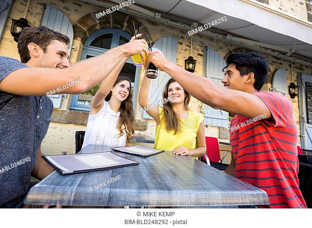 Friends toasting at restaurant