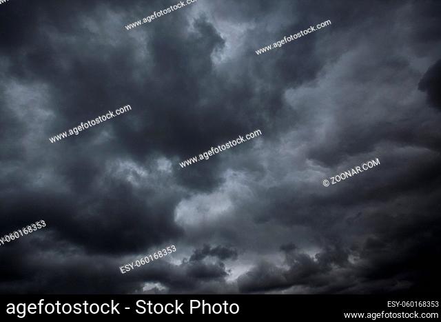 Black stormy clouds, may be used as background. Dramatic sky