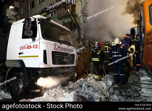 RUSSIA, NOVOSIBIRSK - FEBRUARY 9, 2023: Rescuers carry out a search and rescue operation at the site of a gas explosion in a five storey apartment building