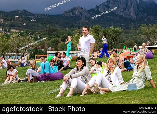 RUSSIA, YALTA - SEPTEMBER 16, 2023: People are seen during Winepark Fest, a wine harvest winemaking festival, in Vinny Park in the Black Sea resort of Yalta