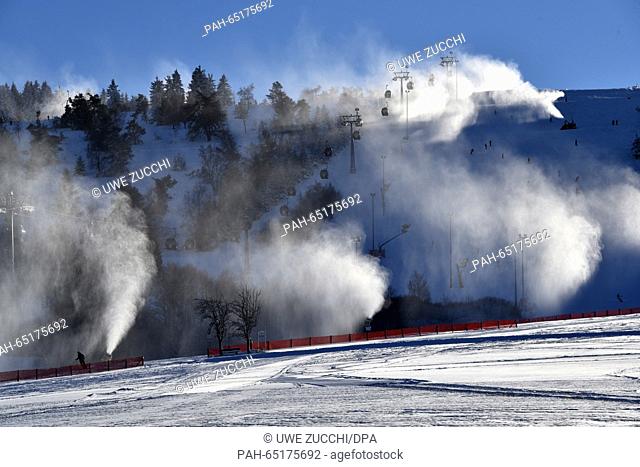 Snow machines produce white clouds of artificial snow at the Ettelsberg ski slope in Willingen, Germany, 19 January 2016